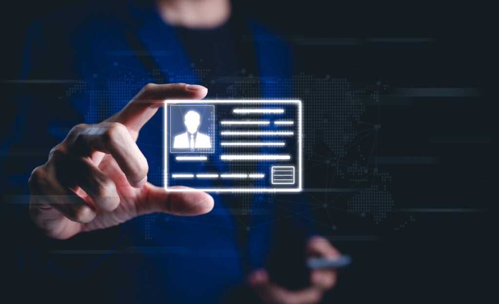 Symbolic image representing a businessman holding a glowing PIV card, symbolizing digital identity verification and security in Personal Identity Verification.