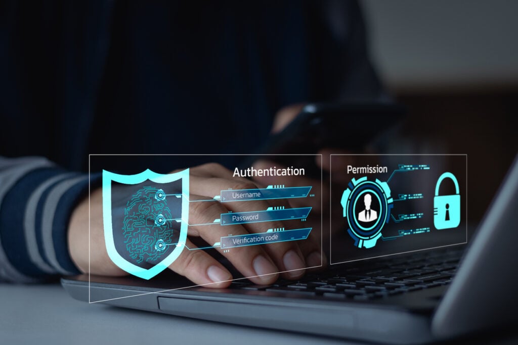 A user authenticating on their laptop is challenged for Risk-Based Authentication in the form of a password and verification code.