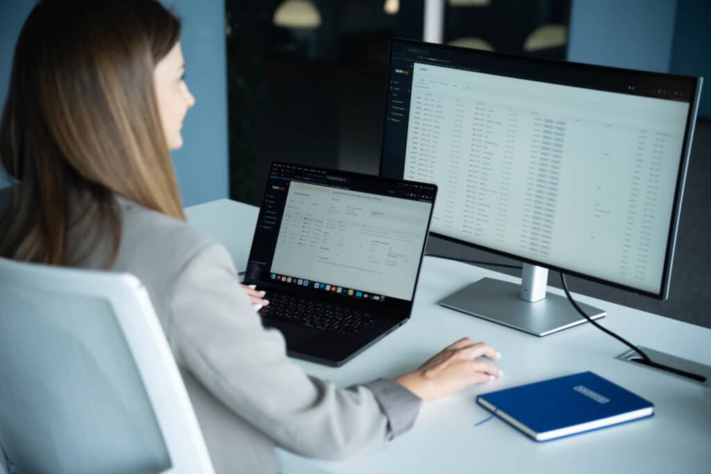 Person working at a computer in the Podlasie S.A. office