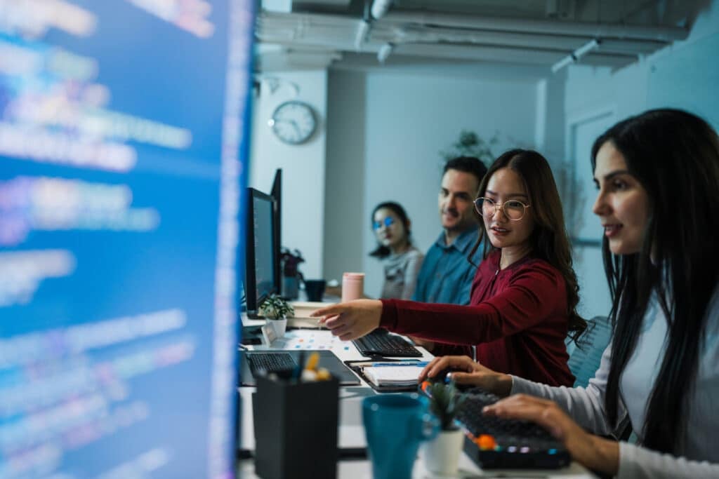 IT professionals working together in a modern enterprise technology environment