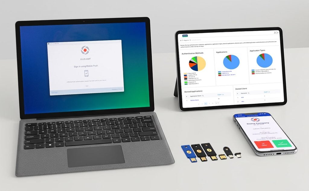 Picture showing YubiKeys next to a smartphone with a mobile app, a tablet, and a laptop, representing strong MFA methods for securing IT infrastructure.